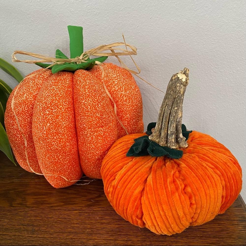 Two handmade orange pumpkins
